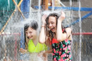 Girls splashing at indoor waterpark