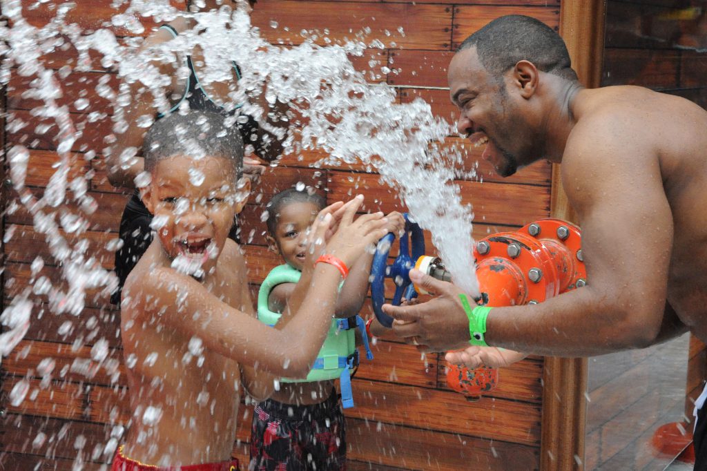 Family splashing at indoor waterpark